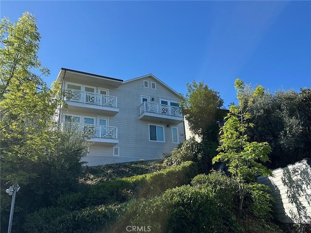 view of property exterior featuring a balcony