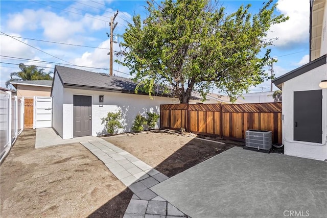 view of patio featuring a fenced backyard and central AC