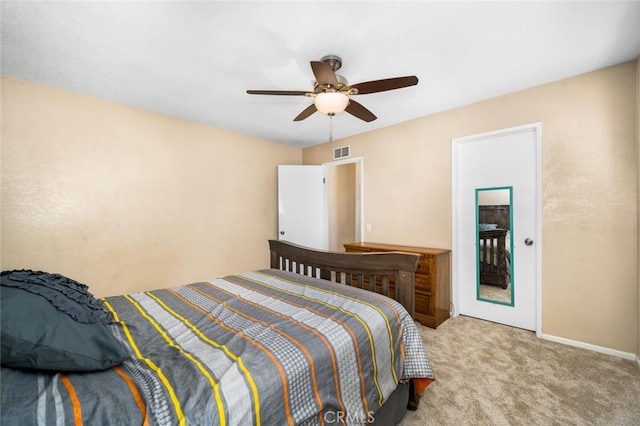 bedroom with visible vents, a ceiling fan, baseboards, and carpet floors