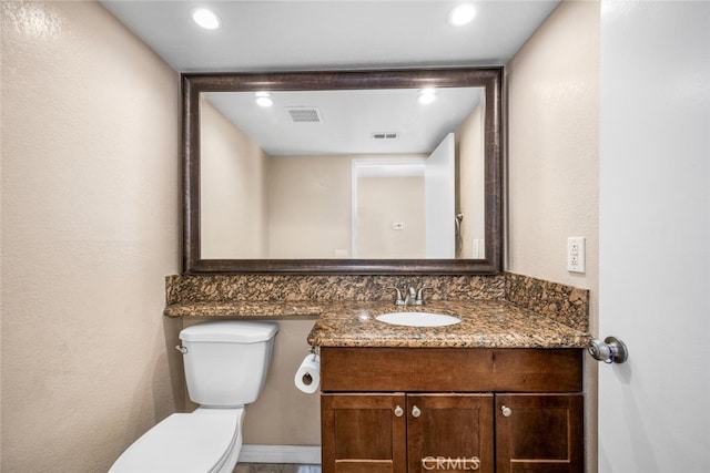 half bath with visible vents, recessed lighting, and toilet
