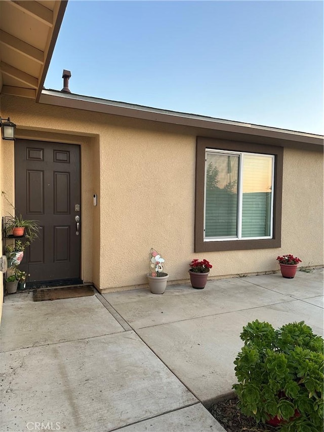 628 Marcus St, Merced, CA 95341 - view of exterior entry featuring a patio and stucco siding