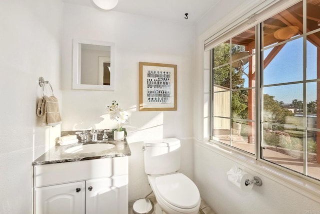 bathroom featuring vanity and toilet