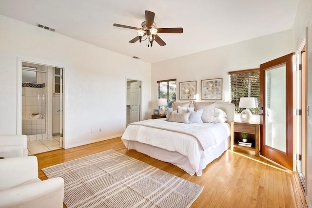 bedroom featuring baseboards, a ceiling fan, light wood-style flooring, and visible vents