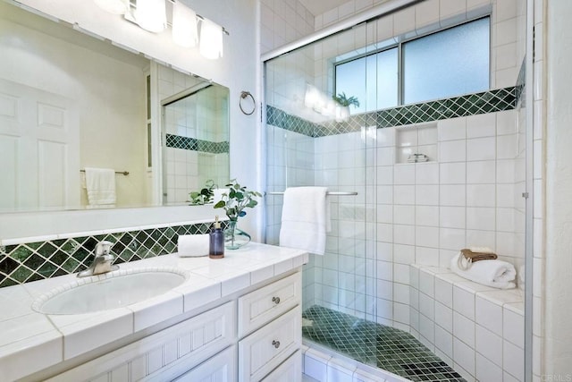 2525 Jackson St, San Diego, CA 92110 - bathroom featuring vanity, a stall shower, and backsplash