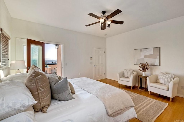 2525 Jackson St, San Diego, CA 92110 - bedroom featuring access to exterior, wood finished floors, and a ceiling fan