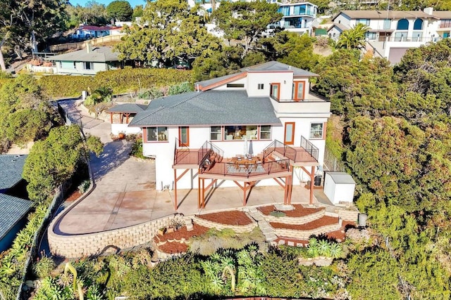 2525 Jackson St, San Diego, CA 92110 - rear view of property featuring stucco siding, a deck, and a patio