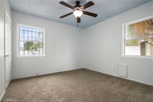 8165 Shadyside Ave, Whittier, CA 90606 - spare room with carpet, healthy amount of natural light, a ceiling fan, and a textured ceiling