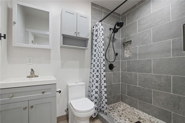8165 Shadyside Ave, Whittier, CA 90606 - bathroom featuring a tile shower, vanity, and toilet
