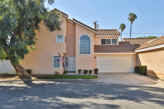 3514 Myers St Unit 15, Riverside, CA 92503 - view of front of property with a tiled roof, stucco siding, concrete driveway, and an attached garage