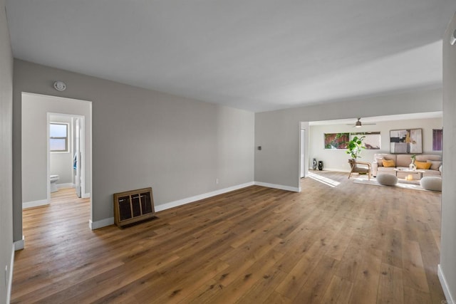 6662 Birchwood St, San Diego, CA 92120 - unfurnished living room featuring hardwood / wood-style flooring, baseboards, heating unit, and ceiling fan