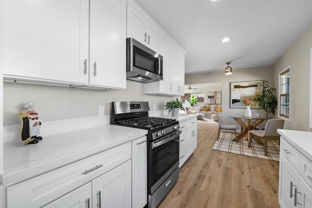 6662 Birchwood St, San Diego, CA 92120 - kitchen featuring appliances with stainless steel finishes, white cabinets, light wood finished floors, recessed lighting, and ceiling fan