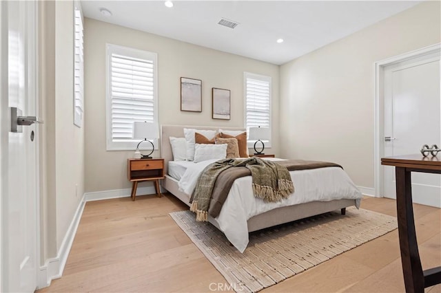 bedroom featuring recessed lighting, baseboards, light wood-type flooring, and visible vents