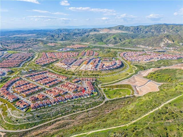 birds eye view of property featuring a mountain view