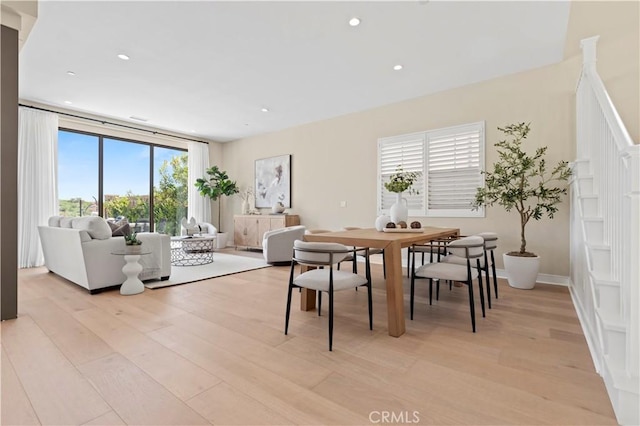 dining space featuring recessed lighting and light wood finished floors