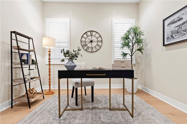 office with baseboards and wood finished floors