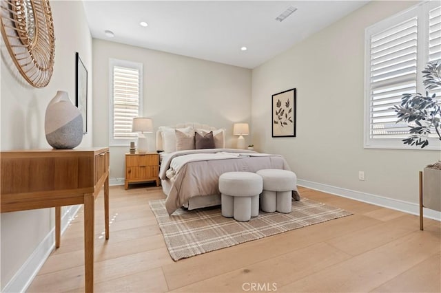 bedroom with recessed lighting, baseboards, visible vents, and light wood-style floors