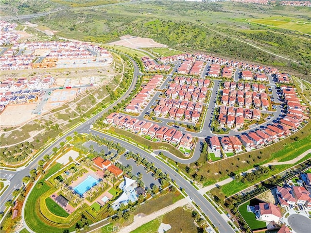 birds eye view of property with a residential view