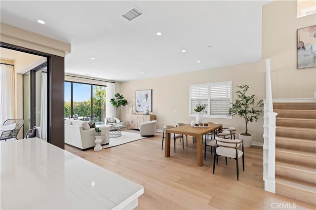 dining room featuring stairs, recessed lighting, visible vents, and light wood-style floors