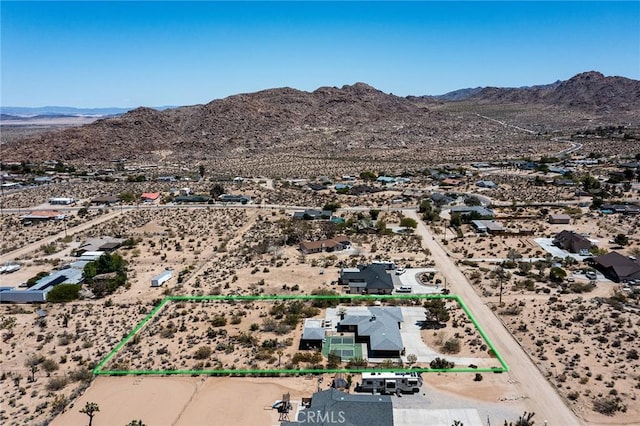 aerial view with a desert view, a mountain view, and a rural view