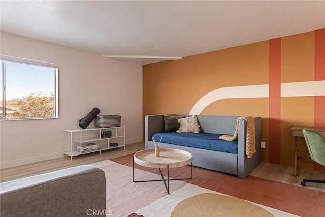 living room featuring baseboards and wood finished floors