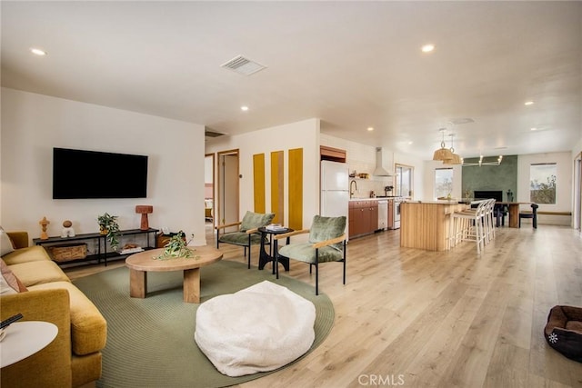 61584 Pueblo Trl, Joshua Tree, CA 92252 - living area featuring light wood-style flooring, recessed lighting, and a fireplace