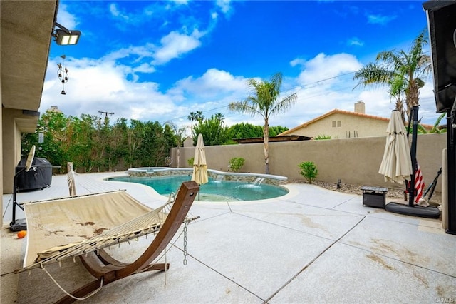 68245 Peladora Rd, Cathedral City, CA 92234 - view of pool with grilling area, a patio, a pool with connected hot tub, and fence