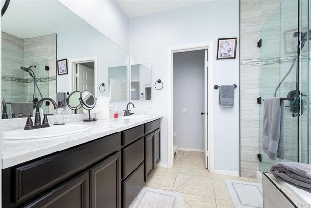68245 Peladora Rd, Cathedral City, CA 92234 - bathroom featuring double vanity, a sink, and a stall shower