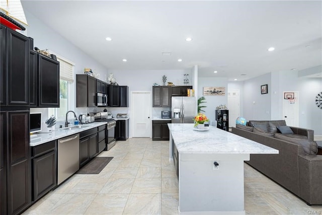 68245 Peladora Rd, Cathedral City, CA 92234 - kitchen with appliances with stainless steel finishes, a sink, a center island, recessed lighting, and open floor plan