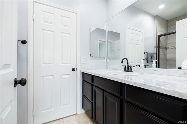 68245 Peladora Rd, Cathedral City, CA 92234 - full bath featuring vanity, tile patterned flooring, and a shower stall