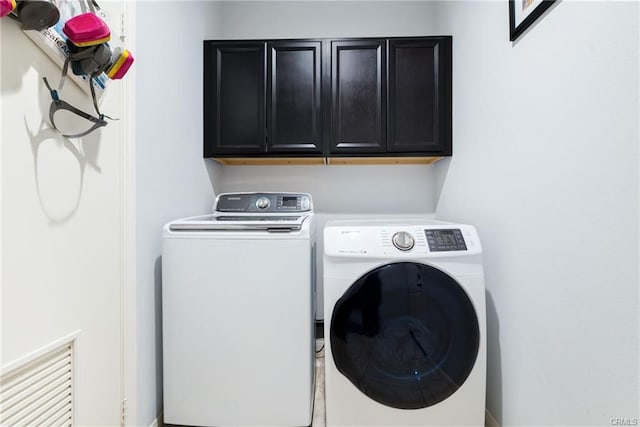 68245 Peladora Rd, Cathedral City, CA 92234 - laundry room featuring cabinet space and washing machine and dryer