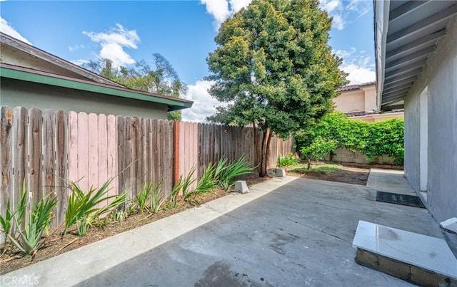view of patio / terrace featuring fence