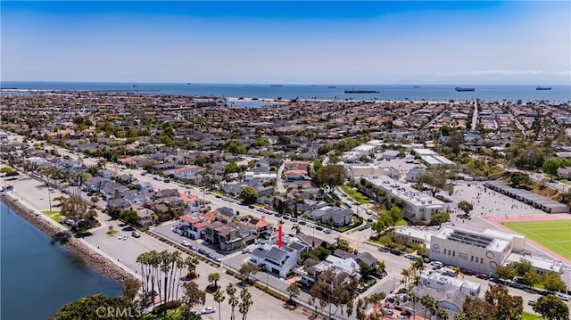 drone / aerial view featuring a residential view and a water view