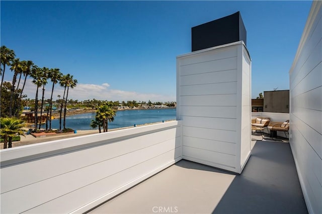 balcony featuring a water view