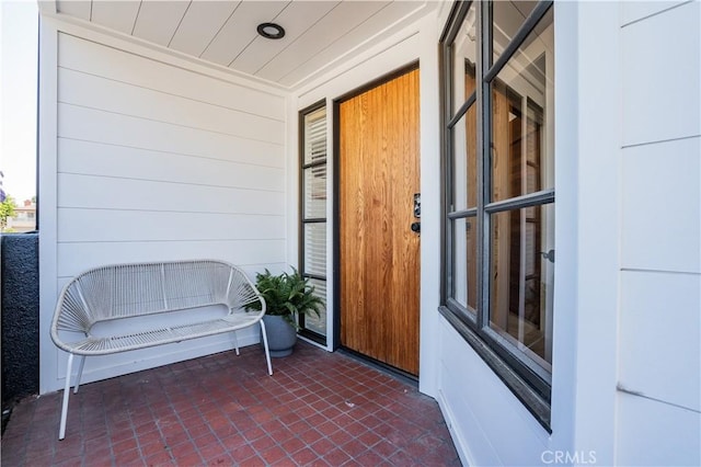 doorway to property featuring a porch