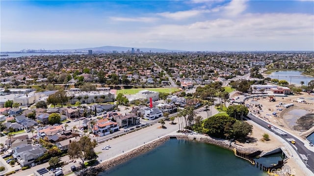 drone / aerial view featuring a residential view and a water view