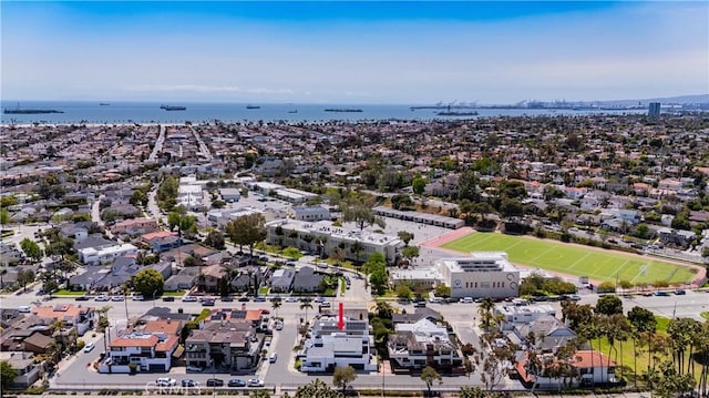 drone / aerial view with a water view and a residential view