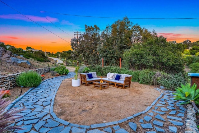 patio terrace at dusk with an outdoor hangout area
