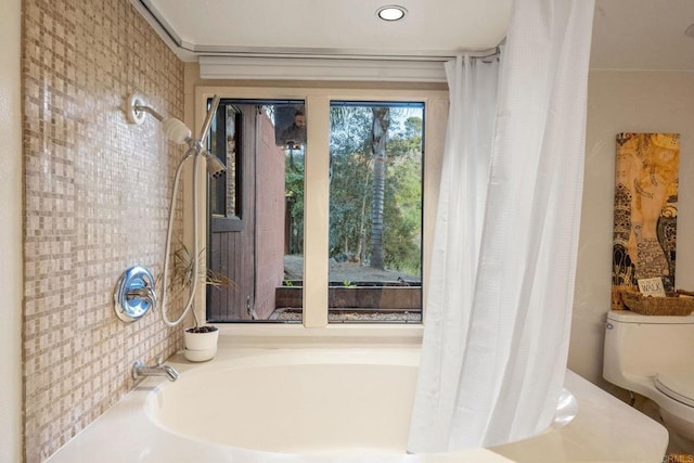 full bathroom featuring a bath, toilet, and a shower with curtain