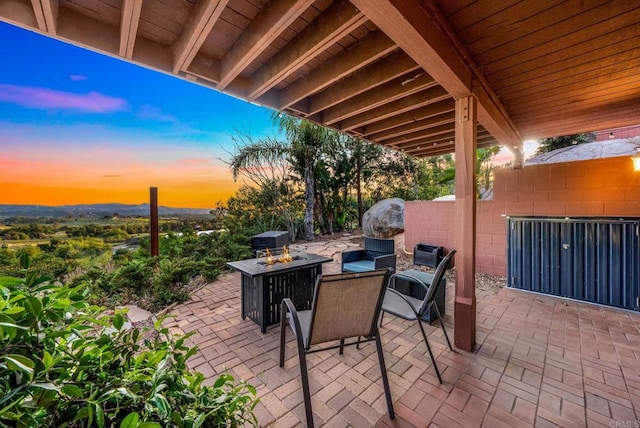 view of patio terrace at dusk