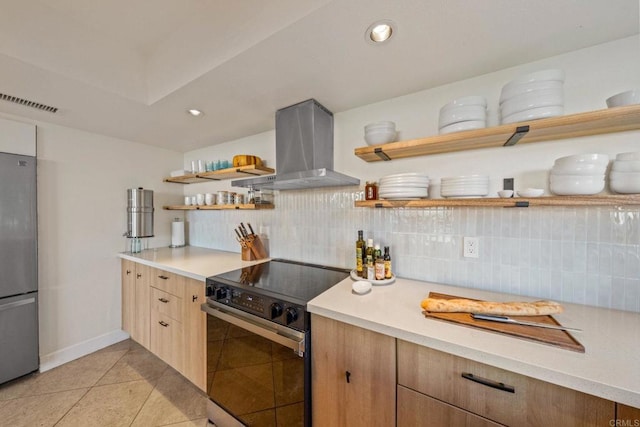 kitchen with open shelves, light countertops, freestanding refrigerator, island exhaust hood, and range with electric stovetop