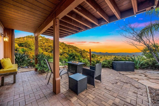 patio terrace at dusk with an outdoor fire pit