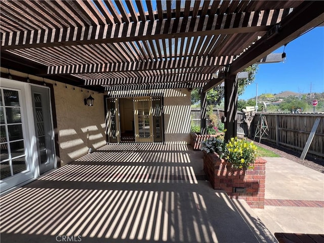 view of patio / terrace featuring a pergola and a fenced backyard