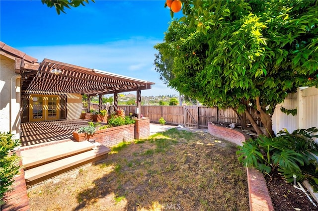 31341 Via Sonora, San Juan Capistrano, CA 92675 - view of yard featuring a patio, a fenced backyard, a pergola, and a gate