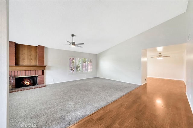 31341 Via Sonora, San Juan Capistrano, CA 92675 - unfurnished living room featuring a fireplace, a ceiling fan, baseboards, wood finished floors, and vaulted ceiling