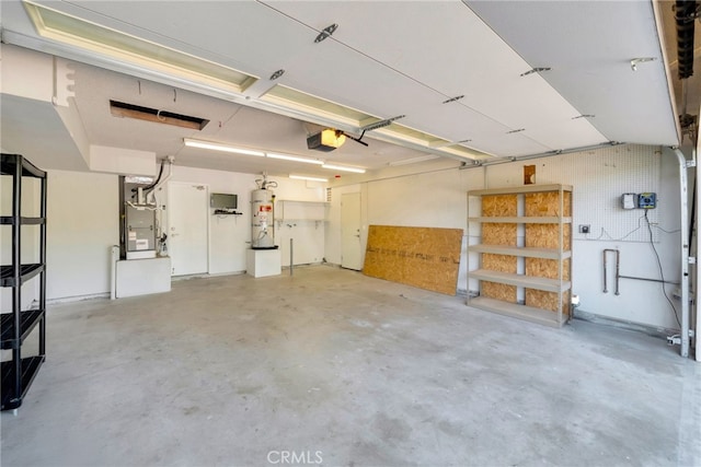 31341 Via Sonora, San Juan Capistrano, CA 92675 - garage featuring heating unit, secured water heater, and a garage door opener