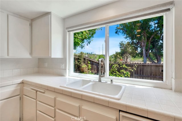 31341 Via Sonora, San Juan Capistrano, CA 92675 - kitchen with a sink, tile countertops, and white cabinets