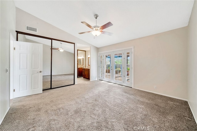 31341 Via Sonora, San Juan Capistrano, CA 92675 - unfurnished bedroom with visible vents, carpet floors, vaulted ceiling, and french doors
