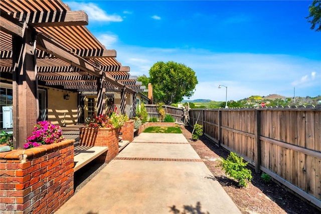 31341 Via Sonora, San Juan Capistrano, CA 92675 - view of patio / terrace with a fenced backyard and a pergola