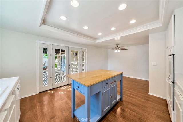 31341 Via Sonora, San Juan Capistrano, CA 92675 - kitchen with a raised ceiling, wooden counters, french doors, and dark wood-style floors
