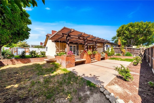 31341 Via Sonora, San Juan Capistrano, CA 92675 - rear view of house featuring a fenced backyard, a pergola, stucco siding, and a patio area